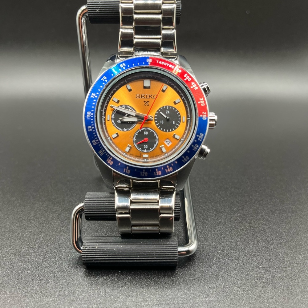 Seiko Silver Watch with Blue and Red Bezel